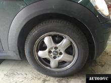 Installing a set of spacers to increase the ground clearance Mini Cooper MINI Hatch II Lift Kits (leveling kits and coil spacer\strut spacer)