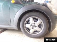 Installing a set of spacers to increase the ground clearance Mini Cooper MINI Hatch II Lift Kits (leveling kits and coil spacer\strut spacer)