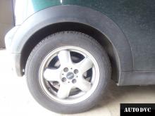 Installing a set of spacers to increase the ground clearance Mini Cooper MINI Hatch II Lift Kits (leveling kits and coil spacer\strut spacer)