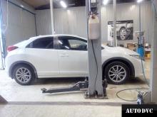 Installing a set of spacers to increase the ground clearance Honda Civic IX Lift Kits (leveling kits and coil spacer\strut spacer)