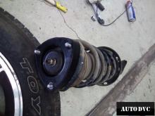 Installing a set of spacers to increase the ground clearance Honda Pilot Lift Kits (leveling kits and coil spring spacer\strut spacer)
