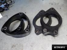Installing a set of spacers to increase the ground clearance Toyota Corolla Lift Kits (leveling kits and coil spacer\strut spacer) cer\strut spacer) 