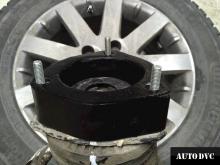 Installing a set of spacers to increase the ground clearance Voyager Lift Kits (leveling kits and coil spring spacer\strut spacer)