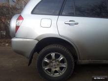 Installing a set of spacers to increase the ground clearance Chery Tiggo (T11) Lift Kits (leveling kits and coil spring spacer\strut spacer)