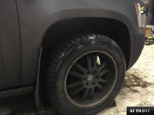 Installing a set of spacers to increase the ground clearance Chevrolet Tahoe Lift Kits (leveling kits and coil spring spacer\strut spacer)