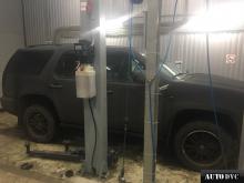 Installing a set of spacers to increase the ground clearance Chevrolet Tahoe Lift Kits (leveling kits and coil spring spacer\strut spacer)