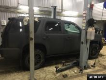 Installing a set of spacers to increase the ground clearance Chevrolet Tahoe Lift Kits (leveling kits and coil spring spacer\strut spacer)