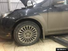 Installing a set of spacers to increase the ground clearance Ford Focus Lift Kits (leveling kits and coil spring spacer\strut spacer)