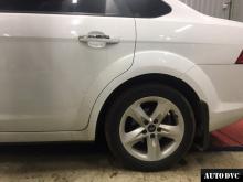 Installing a set of spacers to increase the ground clearance Ford Focus II Lift Kits (leveling kits and coil spring spacer\strut spacer)