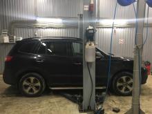 Installing a set of spacers to increase the ground clearance Hyundai Santa Fe II Lift Kits (leveling kits and coil spring spacer\strut spacer)