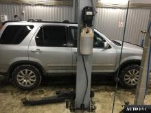 Installing a set of spacers to increase the ground clearance Honda CR-V II Lift Kits (leveling kits and coil spring spacer\strut spacer)