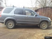 Installing a set of spacers to increase the ground clearance Honda CR-V II Lift Kits (leveling kits and coil spring spacer\strut spacer)