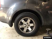 Installing a set of spacers to increase the ground clearance Honda Pilot Lift Kits (leveling kits and coil spring spacer\strut spacer)