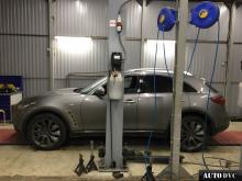 Installing a set of spacers to increase the ground clearance Infiniti FX II Lift Kits (leveling kits and coil spring spacer\strut spacer)