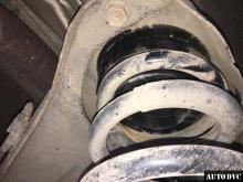 Installing a set of spacers to increase the ground clearance Infiniti QX56 Lift Kits (leveling kits and coil spring spacer\strut spacer)