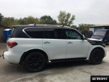 Installing a set of spacers to increase the ground clearance Infiniti QX56 Lift Kits (leveling kits and coil spring spacer\strut spacer)