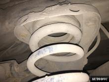 Installing a set of spacers to increase the ground clearance Infiniti QX56 Lift Kits (leveling kits and coil spring spacer\strut spacer)