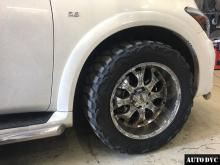 Installing a set of spacers to increase the ground clearance Infiniti QX56 Lift Kits (leveling kits and coil spring spacer\strut spacer)