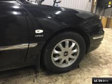 Installing a set of spacers to increase the ground clearance Kia Opirus Lift Kits (leveling kits and coil spring spacer\strut spacer)