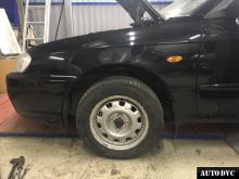 Installing a set of spacers to increase the ground clearance Kia Spectra Lift Kits (leveling kits and coil spring spacer\strut spacer)