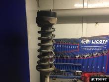 Installing a set of spacers to increase the ground clearance Land Rover Discovery 3 Lift Kits (leveling kits and coil spring spacer\strut spacer)