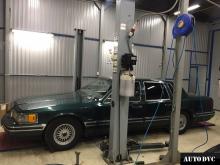 Installing a set of spacers to increase the ground clearance Lincoln Town Car II Lift Kits (leveling kits and coil spring spacer\strut spacer)