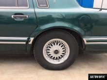 Installing a set of spacers to increase the ground clearance Lincoln Town Car II Lift Kits (leveling kits and coil spring spacer\strut spacer)