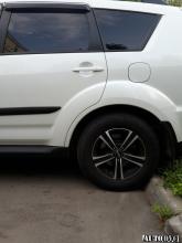 Installing a set of spacers to increase the ground clearance Mitsubishi Outlander II Lift Kits (leveling kits and coil spring spacer\strut spacer)