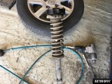 Installing a set of spacers to increase the ground clearance Mitsubishi Carisma Lift Kits (leveling kits and coil spring spacer\strut spacer)