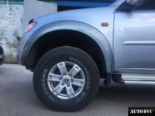 Installing a set of spacers to increase the ground clearance Mitsubishi L200 IV Lift Kits (leveling kits and coil spring spacer\strut spacer)