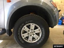 Installing a set of spacers to increase the ground clearance Mitsubishi L200 IV Lift Kits (leveling kits and coil spring spacer\strut spacer)