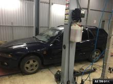 Installing a set of spacers to increase the ground clearance Mitsubishi Legnum Lift Kits (leveling kits and coil spring spacer\strut spacer)