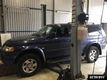 Installing a set of spacers to increase the ground clearance Mitsubishi Pajero III Lift Kits (leveling kits and coil spring spacer\strut spacer)