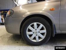 Installing a set of spacers to increase the ground clearance Nissan Almera Lift Kits (leveling kits and coil spring spacer\strut spacer)