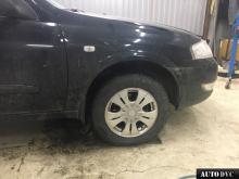 Installing a set of spacers to increase the ground clearance Nissan Almera Lift Kits (leveling kits and coil spring spacer\strut spacer)