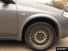 Installing a set of spacers to increase the ground clearanceNissan Primera Lift Kits (leveling kits and coil spring spacer\strut spacer)