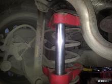 Installing a set of spacers to increase the ground clearance Chevrolet Cruze I Lift Kits (leveling kits and coil spring spacer\strut spacer)