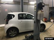Installing a set of spacers to increase the ground clearance Toyota IQ Lift Kits (leveling kits and coil spring spacer\strut spacer)