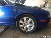 Installing a set of spacers to increase the ground clearance Jaguar X-Type Lift Kits (leveling kits and coil spring spacer\strut spacer)